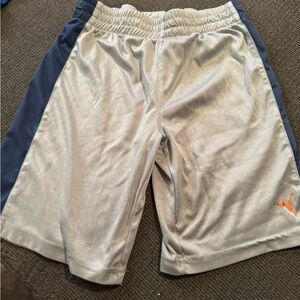 Grey puma shorts for boys with one blue line on the sides